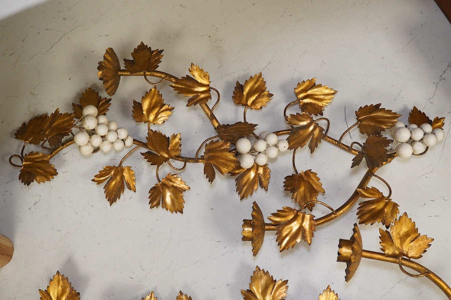 A pair of gilt metal and porcelain ‘white berry’ two branch wall sconces, 55.5cm. Condition - fair to good